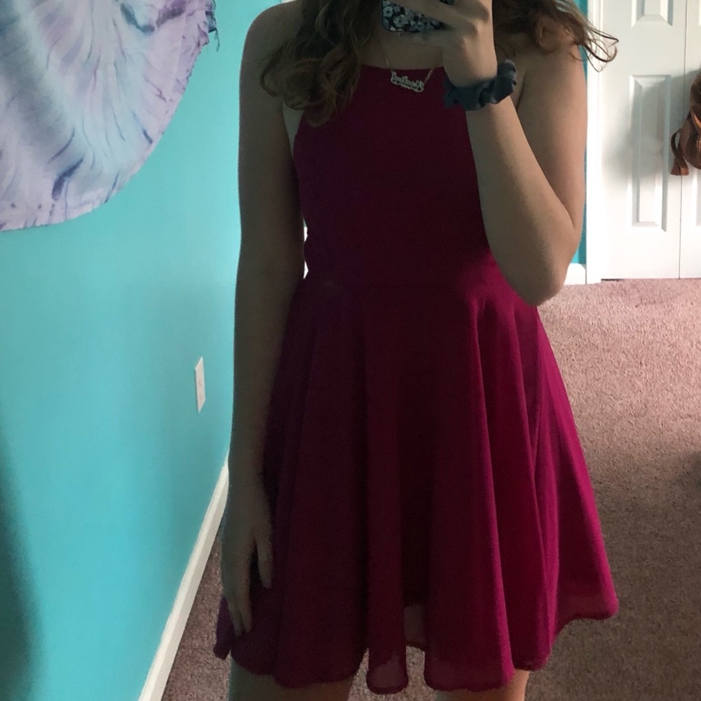 A magenta colored spaghetti strapped dress
